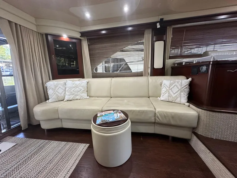 Slide: The Image of Luxurious interior of 2006 Sea Ray 58 Sedan Bridge yacht with cream leather sofa. - 10