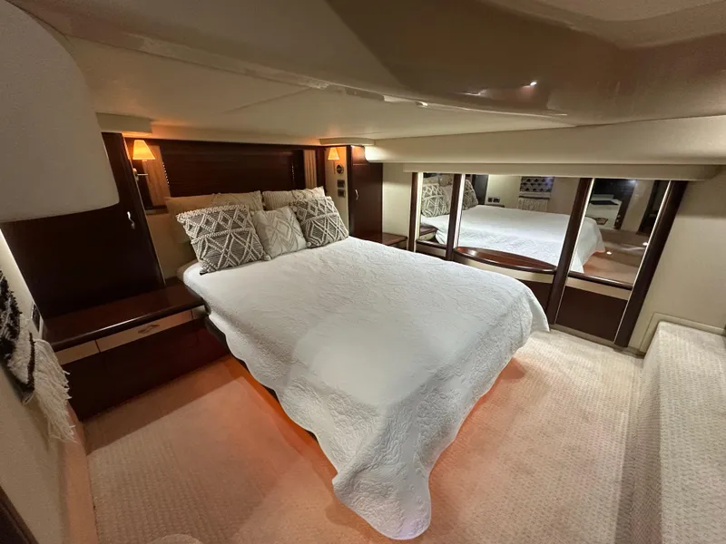Slide: The Image of Luxurious bedroom interior of 2006 Sea Ray 58 Sedan Bridge yacht with elegant bedding. - 13
