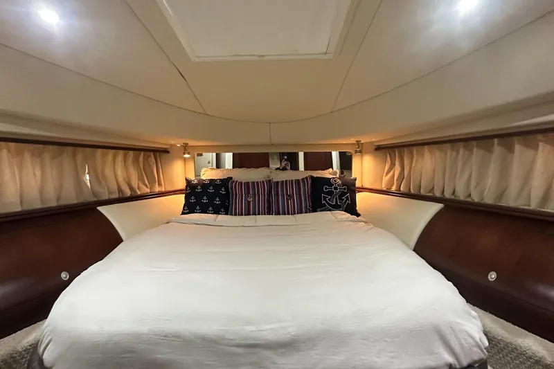 Slide: The Image of Luxurious bedroom interior of 2006 Sea Ray 58 Sedan Bridge yacht with elegant bedding. - 15