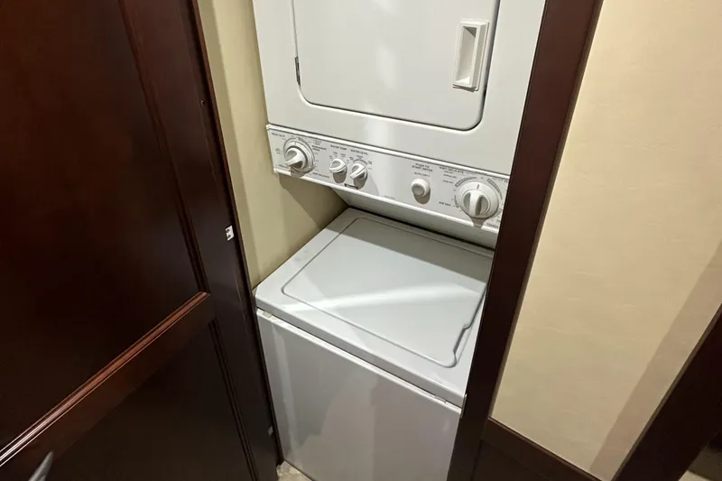 Slide: The Image of Stacked washer and dryer in 2006 Sea Ray 58 Sedan Bridge yacht. - 20