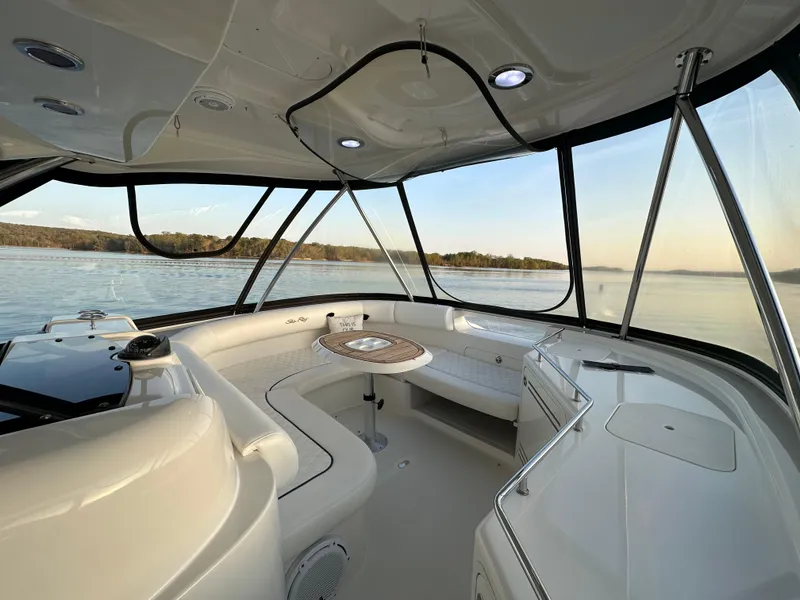 Slide: The Image of 2006 Sea Ray 58 Sedan Bridge interior with panoramic water views. - 3