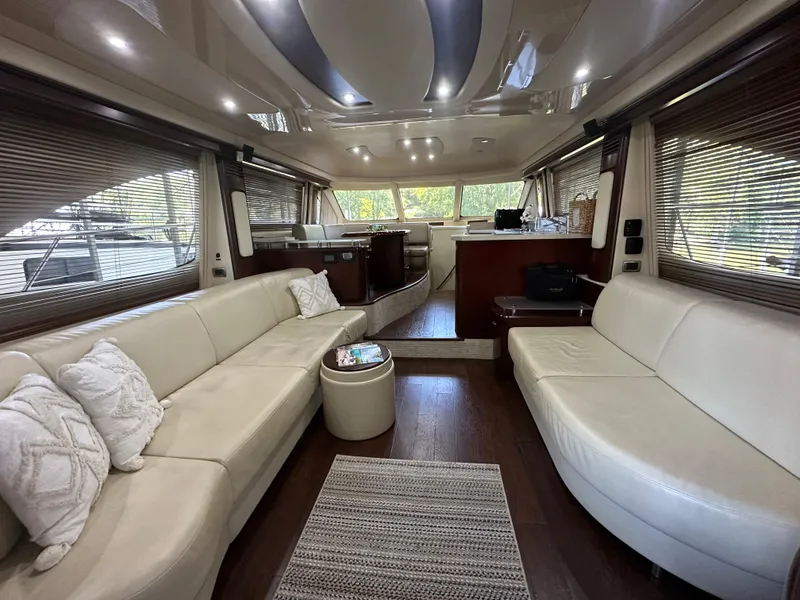Slide: The Image of Luxurious interior of a 2006 Sea Ray 58 Sedan Bridge yacht with elegant seating. - 9