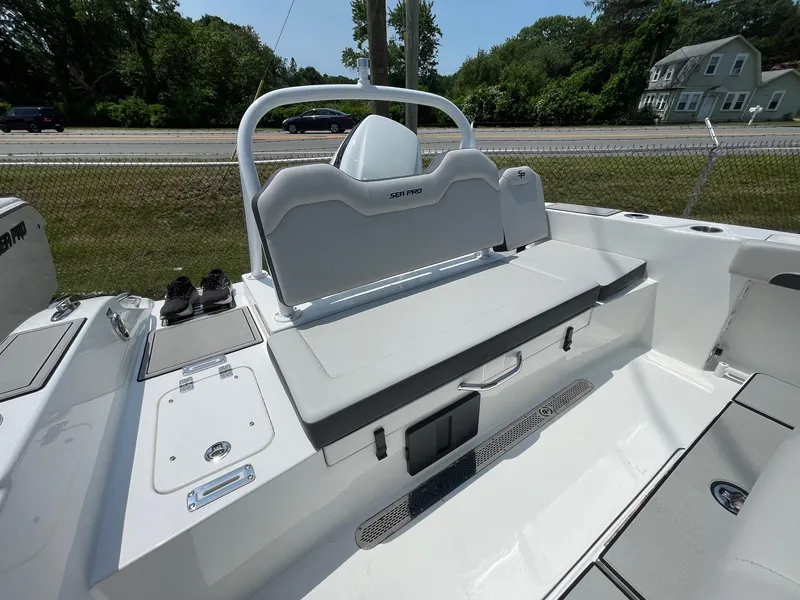 Slide: The Image of 2025 Sea Pro 245 Sandbar boat interior with seating and control panel. - 10