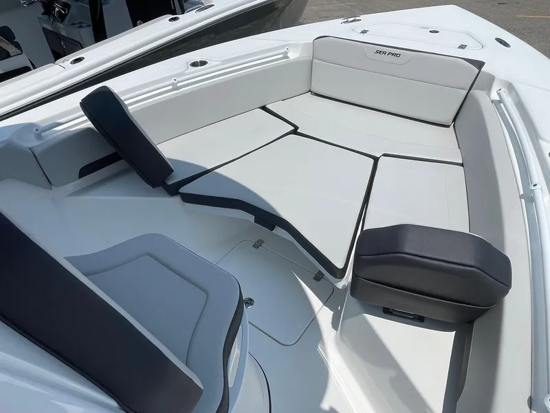 Slide: The Image of 2025 Sea Pro 245 Sandbar boat interior with cushioned seating and sleek design. - 15