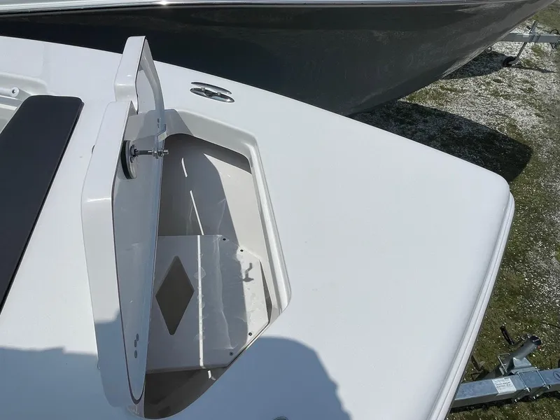 Slide: The Image of 2025 Sea Pro 245 Sandbar boat with open storage compartment on deck. - 16