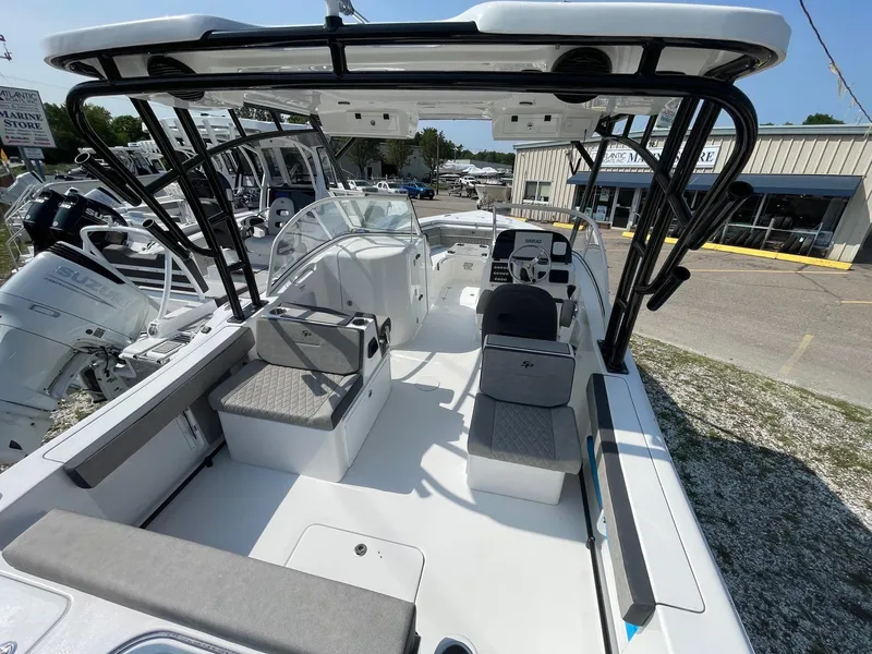 Slide: The Image of 2025 Sea Pro 240 Dual Console boat with spacious seating and modern design. - 14