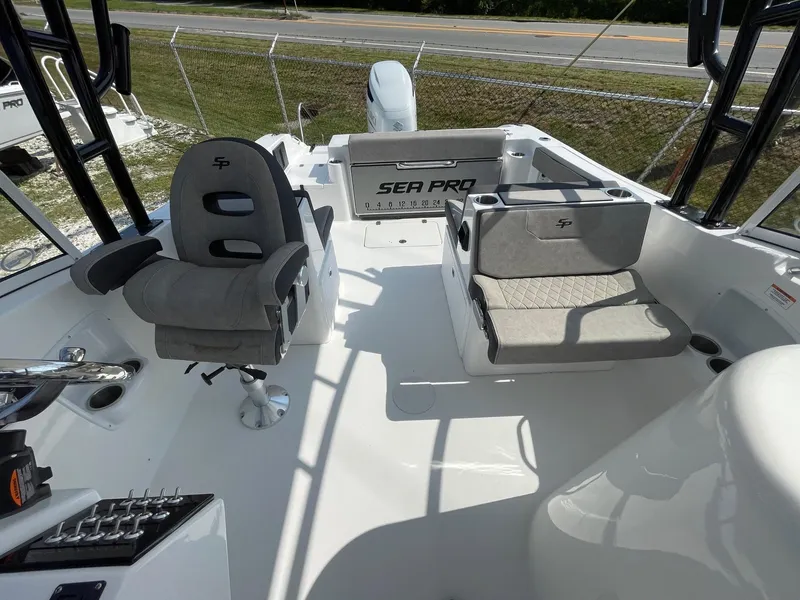 Slide: The Image of 2025 Sea Pro 240 Dual Console boat interior with seating and controls. - 15