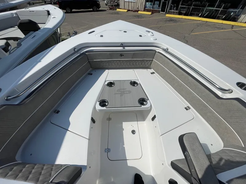 Slide: The Image of 2025 Sea Pro 240 Dual Console boat interior with seating and table. - 20