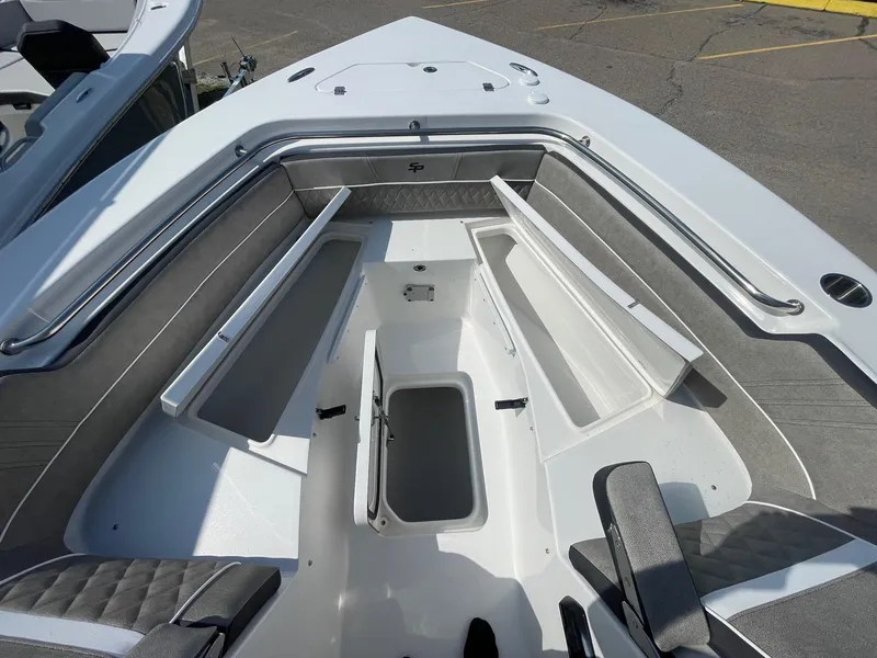 Slide: The Image of 2025 Sea Pro 240 Dual Console boat interior with open storage compartments. - 23