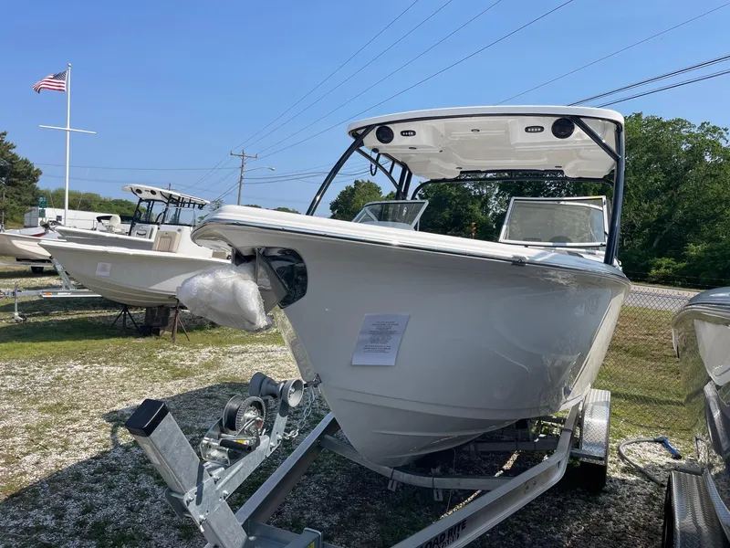 Slide: The Image of 2025 Sea Pro 240 Dual Console boat on trailer, displayed outdoors. - 3