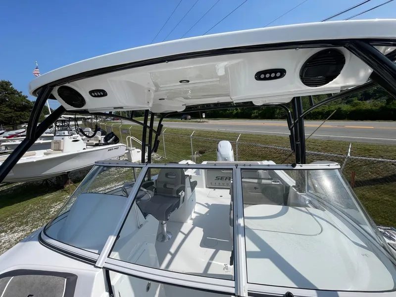 Slide: The Image of 2025 Sea Pro 240 Dual Console boat with sleek design and spacious seating. - 7