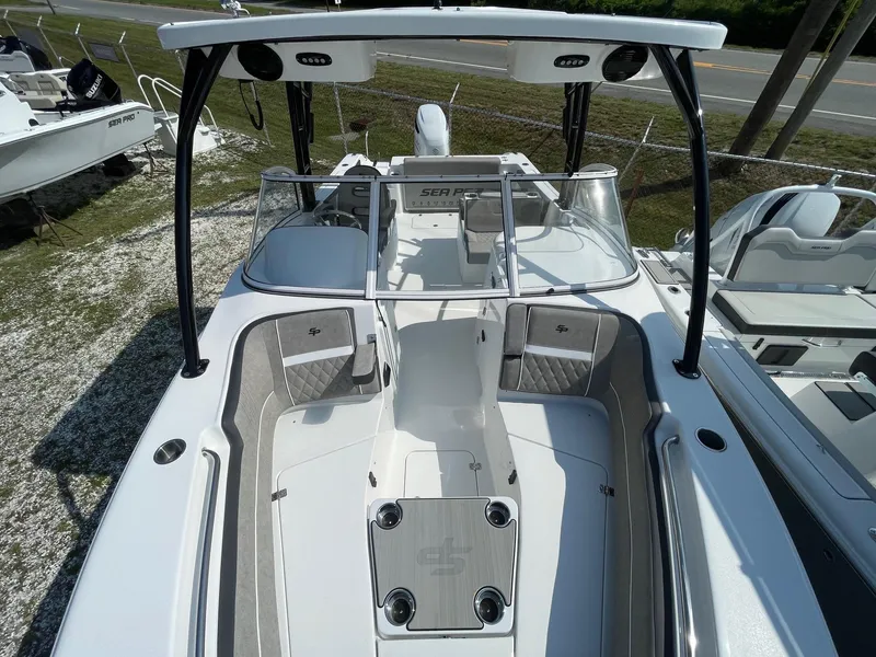 Slide: The Image of 2025 Sea Pro 240 Dual Console boat, white exterior, spacious seating, modern design. - 8