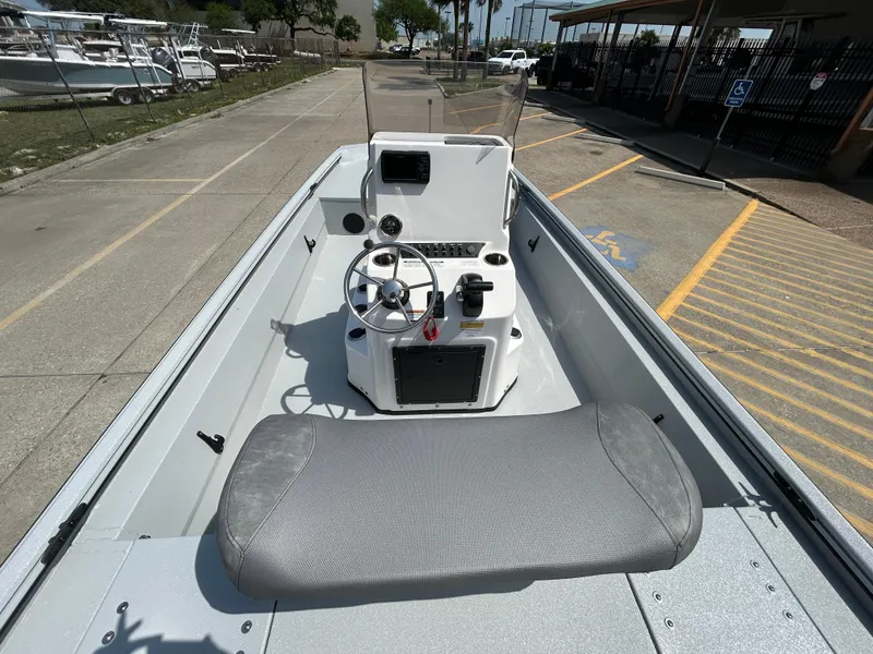 Slide: The Image of 2025 Avid 20 ROGUE CC boat interior with steering console and seating. - 10