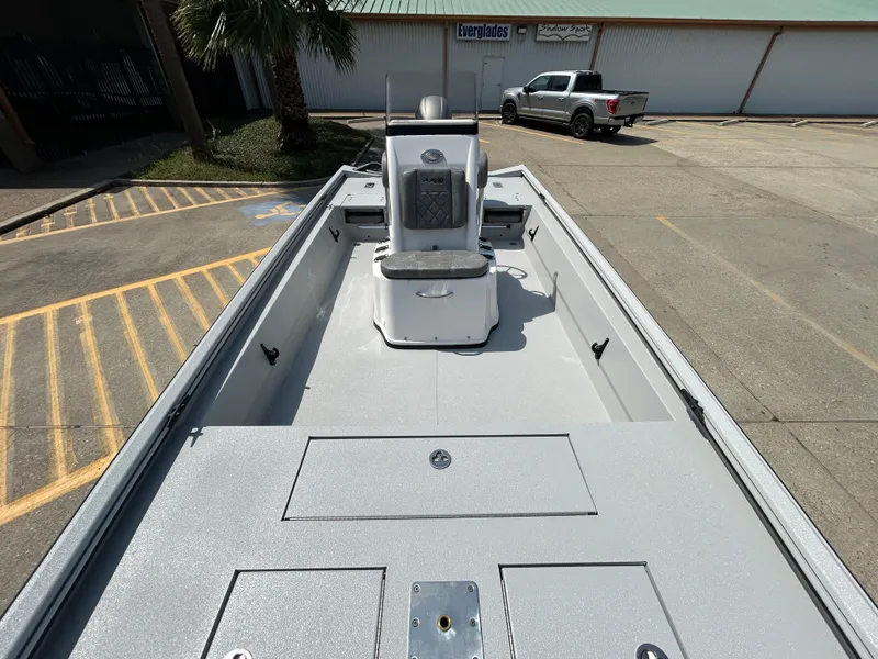 Slide: The Image of 2025 Avid 20 ROGUE CC boat, top view, parked in a lot. - 16