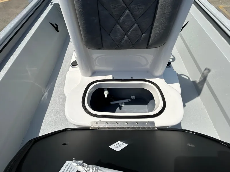 Slide: The Image of 2025 Avid 20 ROGUE CC boat interior with open storage compartment. - 17