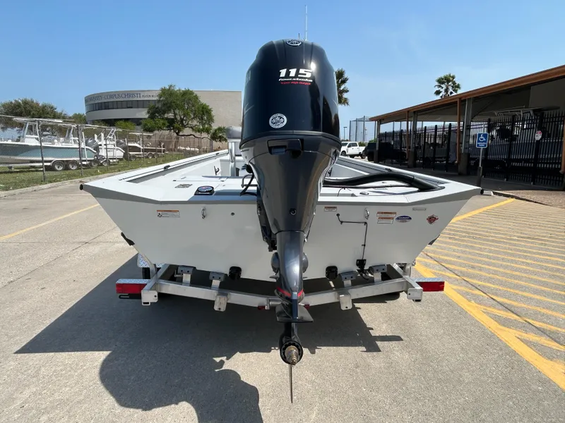 Slide: The Image of 2025 Avid 20 ROGUE CC boat on trailer, rear view with outboard motor. - 7