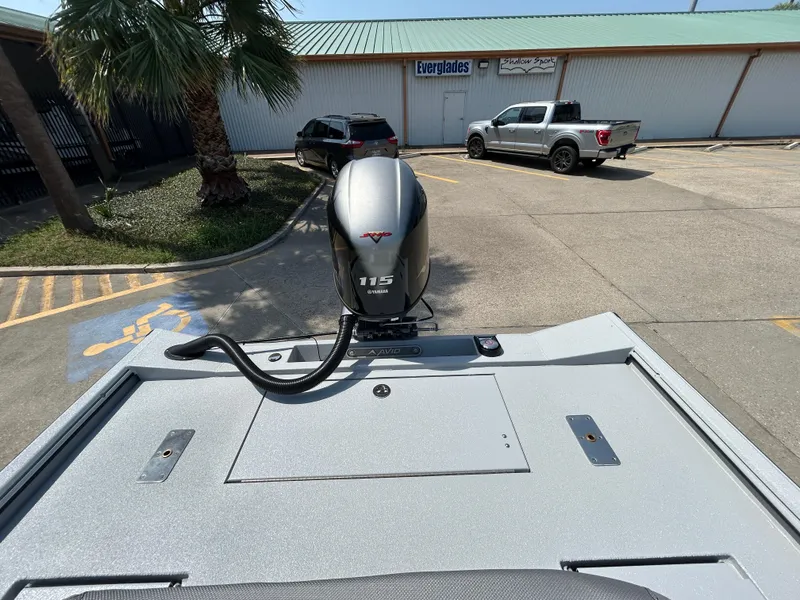 Slide: The Image of Avid 20 ROGUE CC 2025 boat with 115 HP engine in parking lot. - 8