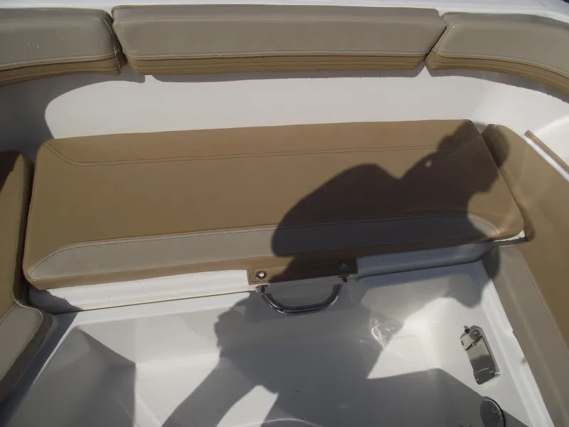 Slide: The Image of 2025 Bayliner Trophy T22SC boat seating area with beige cushions and white interior. - 10