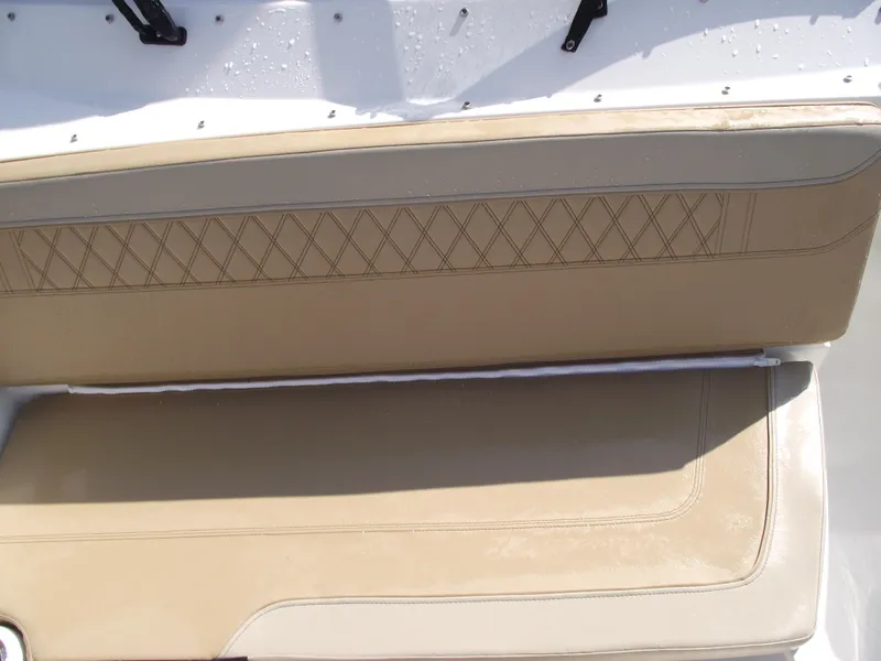 Slide: The Image of 2025 Bayliner Trophy T22SC boat seat with beige upholstery and diamond stitching. - 14