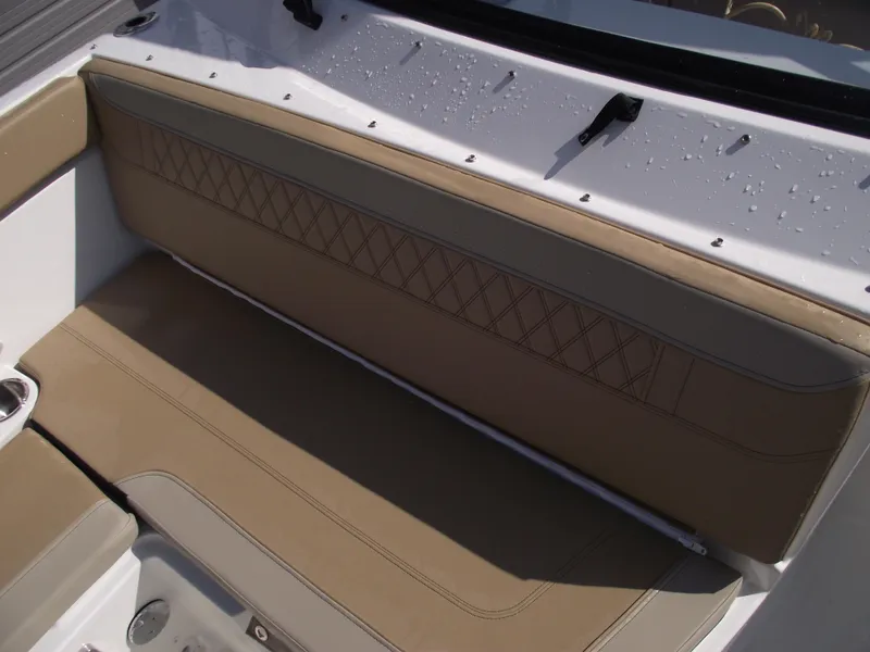 Slide: The Image of 2025 Bayliner Trophy T22SC boat seating with tan upholstery and diamond stitching. - 15
