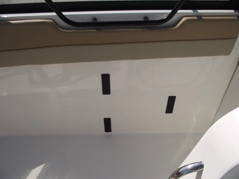 Slide: The Image of 2025 Bayliner Trophy T22SC interior detail with beige and white design elements. - 26