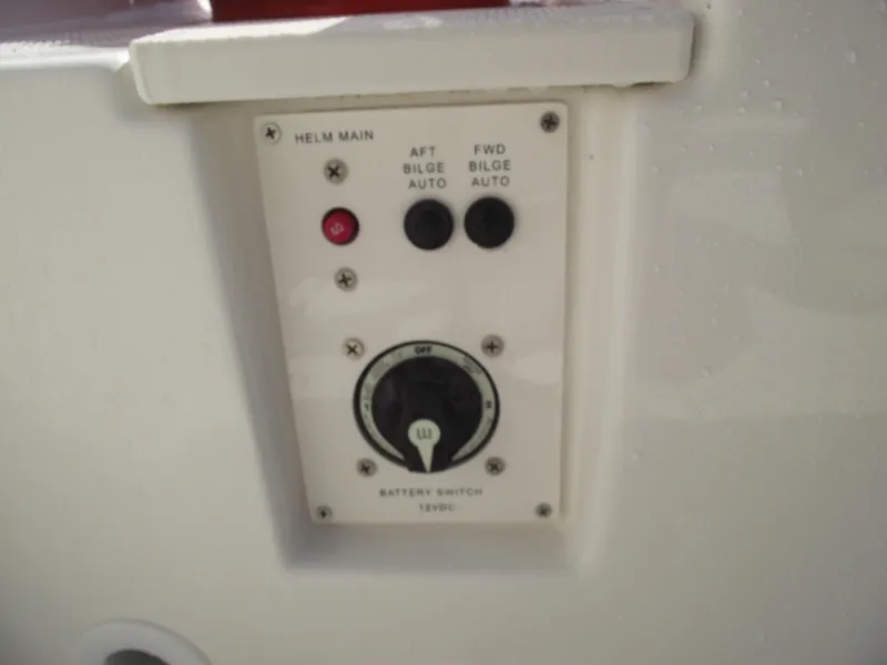 Slide: The Image of Control panel of 2025 Bayliner Trophy T22SC boat with bilge and battery switches. - 35
