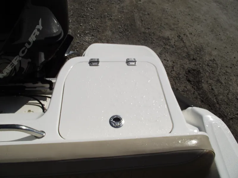 Slide: The Image of 2025 Bayliner Trophy T22SC boat with Mercury engine, featuring a rear storage compartment. - 37