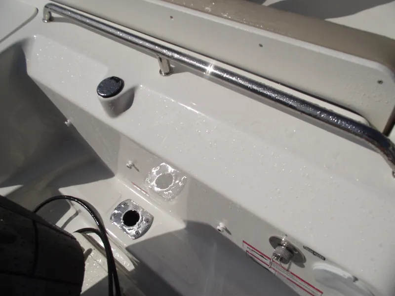 Slide: The Image of 2025 Bayliner Trophy T22SC boat interior detail with chrome rail and fittings. - 42