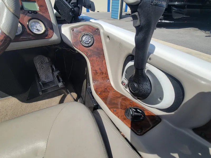 Slide: The Image of 2003 Ranger 521VX NASCAR boat interior with steering wheel and dashboard controls. - 14