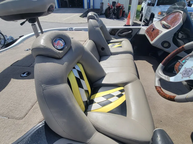 Slide: The Image of 2003 Ranger 521VX NASCAR boat interior with checkered seats and steering wheel. - 15