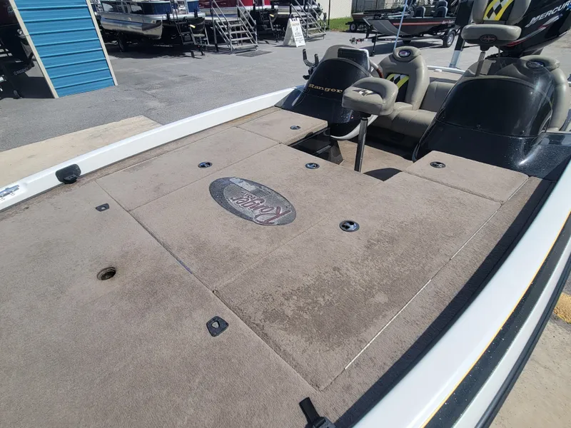 Slide: The Image of 2003 Ranger 521VX NASCAR boat deck with seating and storage compartments. - 7