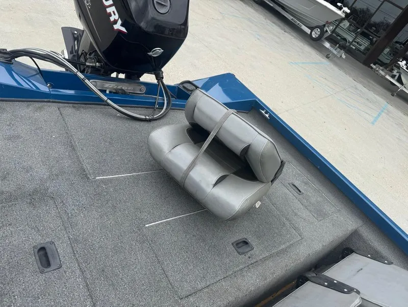 Slide: The Image of 2007 Triton TS 17 boat interior with gray seating and Mercury outboard motor. - 11