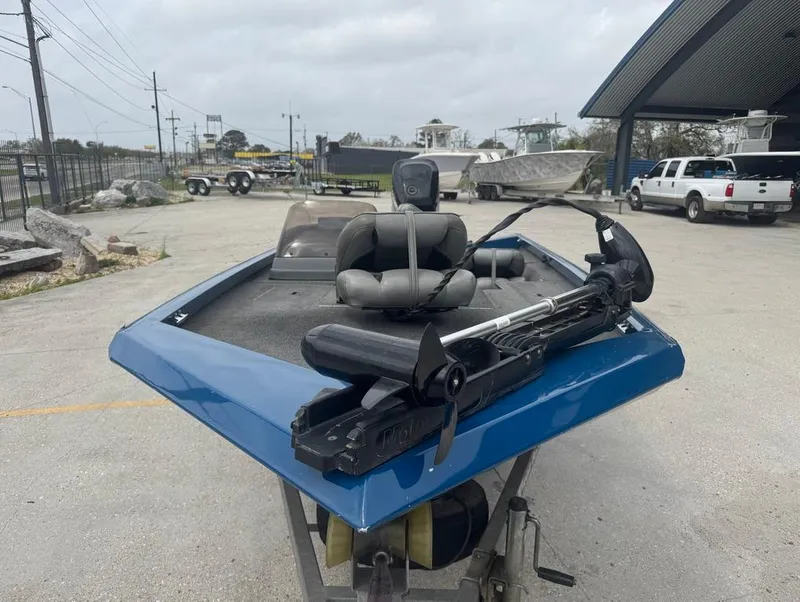 Slide: The Image of 2007 Triton TS 17 boat with trolling motor in a parking lot. - 4