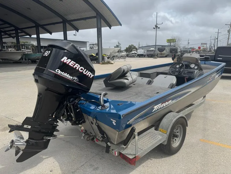 Slide: The Image of 2007 Triton TS 17 boat with Mercury outboard motor on trailer. - 7