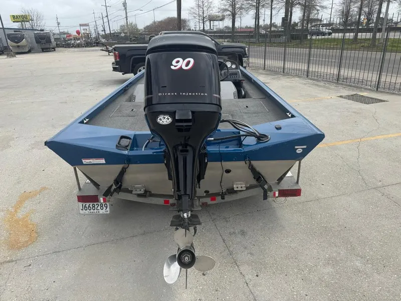 Slide: The Image of 2007 Triton TS 17 boat with 90 horsepower engine, parked in a lot. - 8