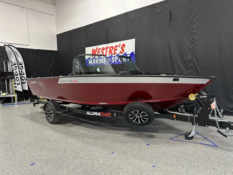 The Image of 2025 Alumacraft Competitor 185X Sport boat on display in showroom. - 0