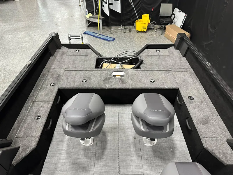 Slide: The Image of 2025 Alumacraft Competitor 185X Sport boat interior at Westre's Marine & Sport showroom. - 11