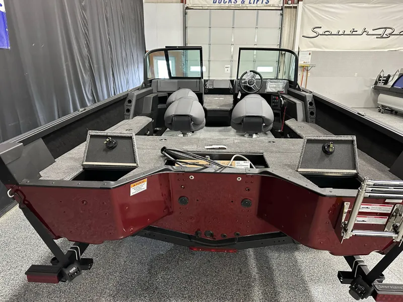 Slide: The Image of Open storage compartment in 2025 Alumacraft Competitor 185X Sport boat, showing interior details. - 15