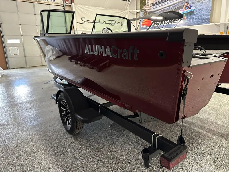 Slide: The Image of 2025 Alumacraft Competitor 185X Sport boat on trailer in showroom. - 4
