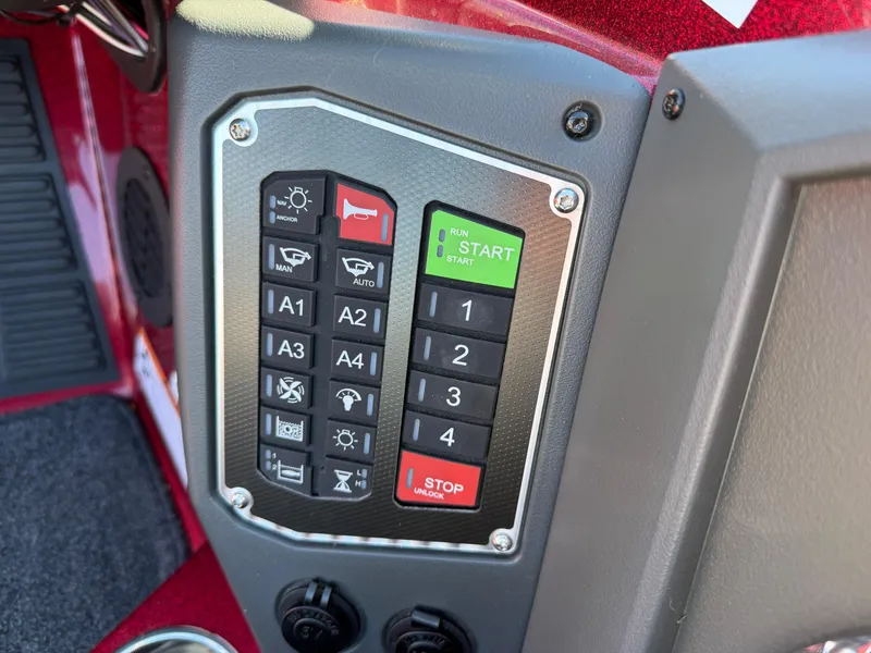 Slide: The Image of Control panel of a 2022 Ranger Z518 boat with start and stop buttons. - 11