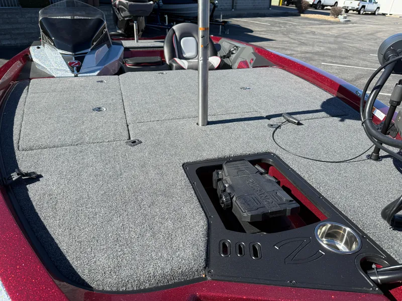 Slide: The Image of 2022 Ranger Z518 boat deck with carpeted surface and storage compartments. - 12