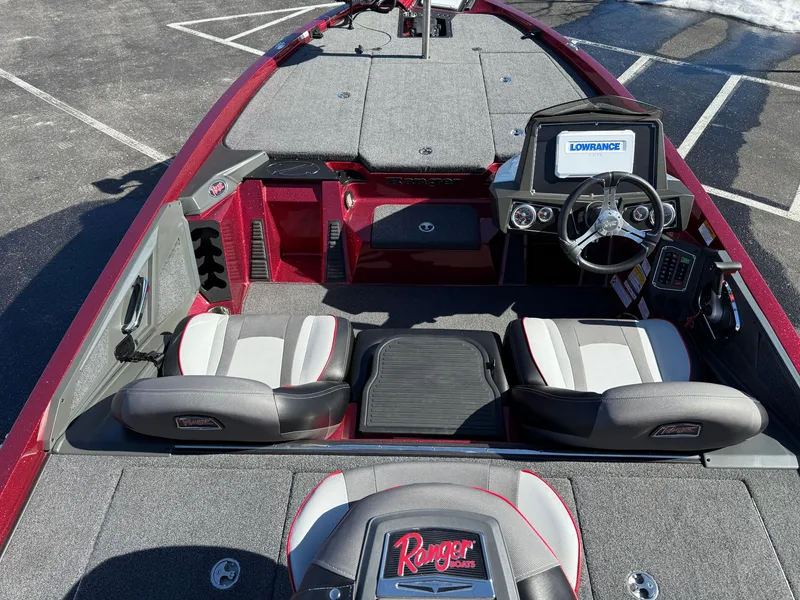 Slide: The Image of 2022 Ranger Z518 boat interior with modern dashboard and seating. - 14