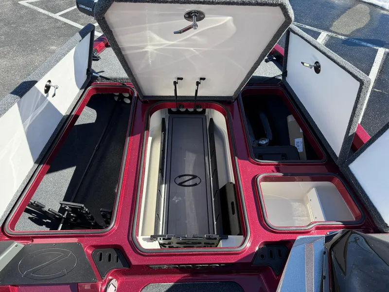 Slide: The Image of 2022 Ranger Z518 boat storage compartments open, showcasing organized interior layout. - 15