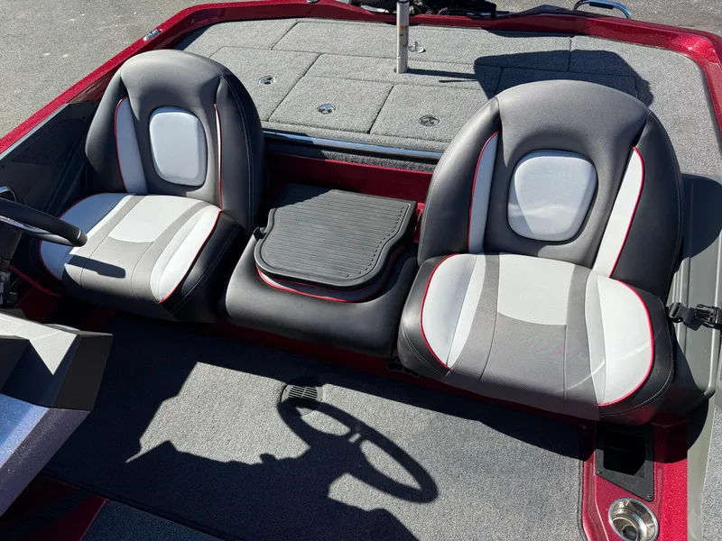 Slide: The Image of 2022 Ranger Z518 boat interior with dual seats and steering wheel. - 17