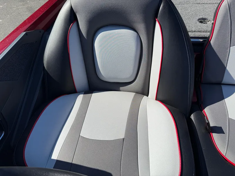 Slide: The Image of 2022 Ranger Z518 boat seat with gray, white, and red accents. - 19