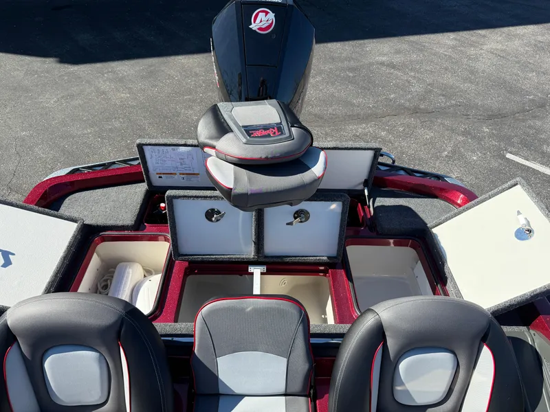 Slide: The Image of 2022 Ranger Z518 boat interior with open storage compartments and seating. - 22
