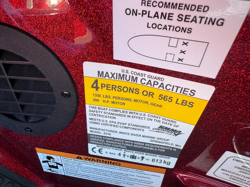 Slide: The Image of 2022 Ranger Z518 capacity label, 4 persons or 565 lbs, U.S. Coast Guard compliant. - 28