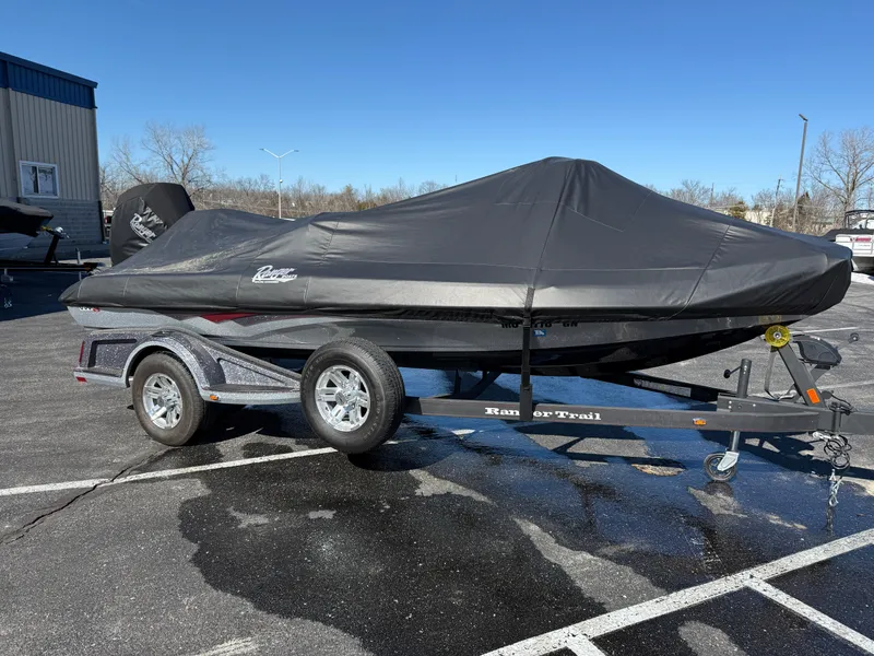 Slide: The Image of 2022 Ranger Z518 boat covered on a trailer in a parking lot. - 32