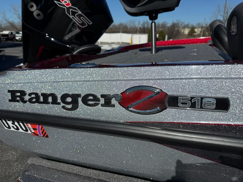 Slide: The Image of 2022 Ranger Z518 boat with metallic finish, close-up of logo and model details. - 5
