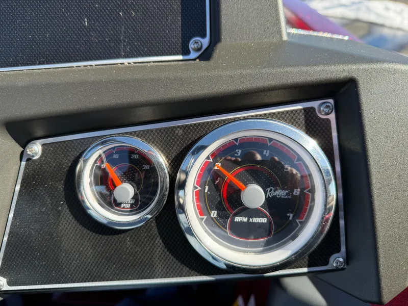 Slide: The Image of Dashboard gauges of a 2022 Ranger Z518 boat, showing RPM and speed. - 9